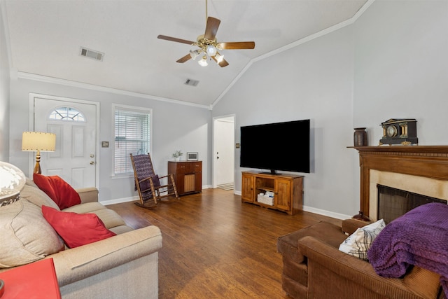living room featuring ornamental molding, a ceiling fan, visible vents, and wood finished floors