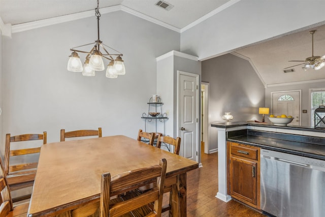 kitchen with visible vents, dark countertops, dishwasher, and lofted ceiling