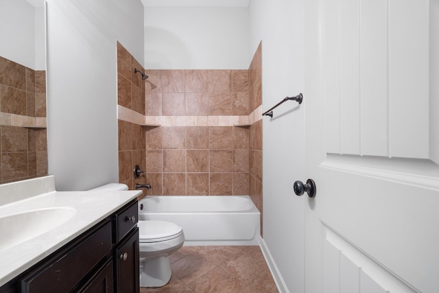 bathroom featuring toilet, vanity, and  shower combination