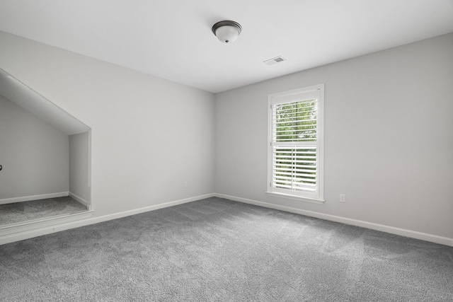 interior space with visible vents, carpet flooring, and baseboards