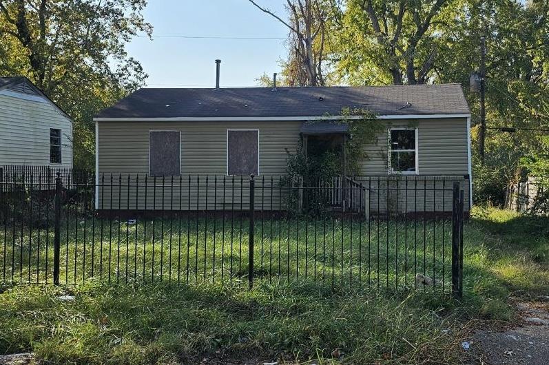 exterior space with a lawn and fence private yard