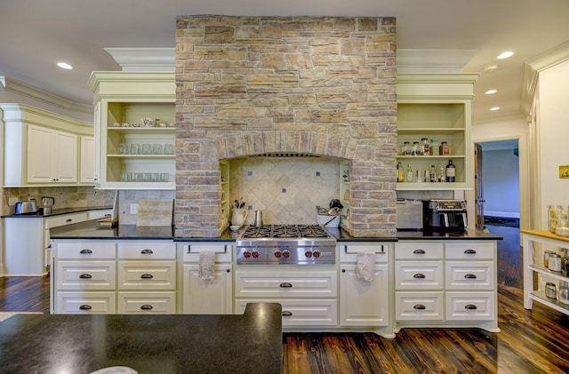 kitchen with stainless steel gas cooktop, open shelves, dark countertops, dark wood-style floors, and crown molding