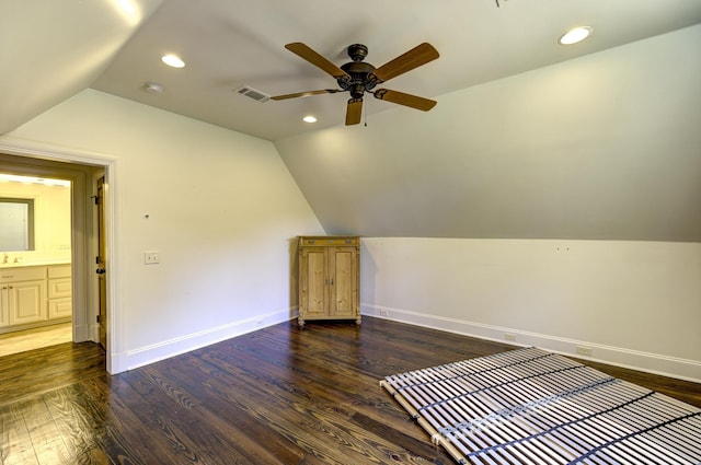 bonus room featuring visible vents, baseboards, vaulted ceiling, wood finished floors, and a ceiling fan
