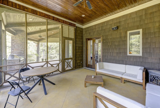 sunroom / solarium with an outdoor living space, ceiling fan, and a healthy amount of sunlight