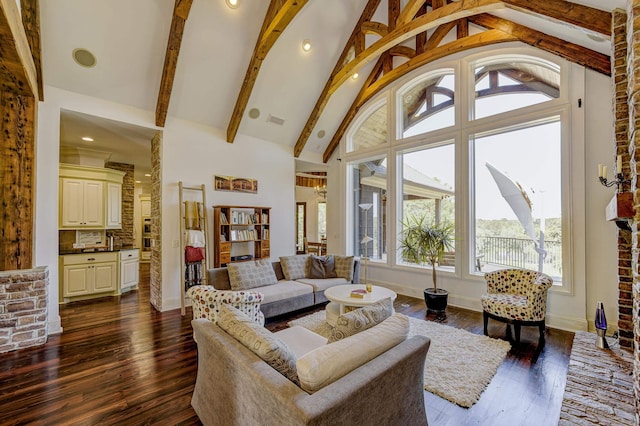 living area featuring dark wood finished floors, visible vents, beam ceiling, and high vaulted ceiling