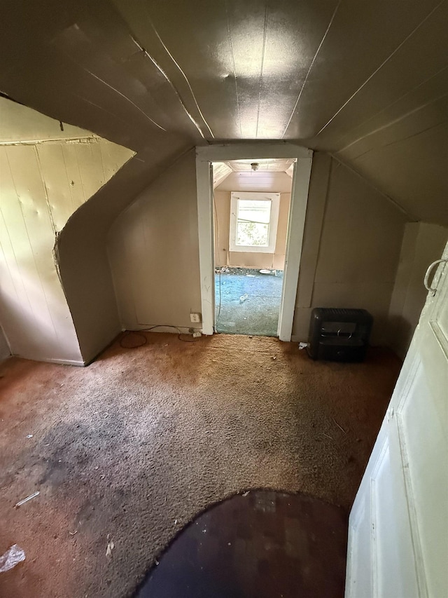 bonus room with carpet and lofted ceiling