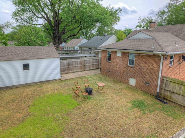 3704 Charleswood Ave, Memphis, TN 38122 - view of yard with an outdoor fire pit and an outbuilding