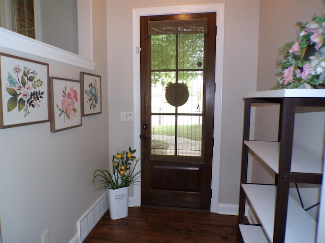 entryway with visible vents, dark wood-style floors, and baseboards