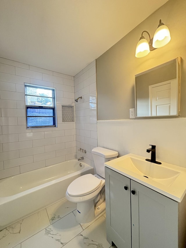 full bathroom featuring bathtub / shower combination, vanity, a wainscoted wall, toilet, and marble finish floor