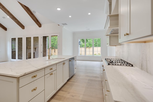 kitchen with light wood-type flooring, custom range hood, a sink, stainless steel appliances, and recessed lighting