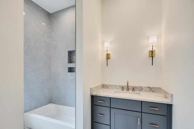 bathroom with a tub to relax in and vanity