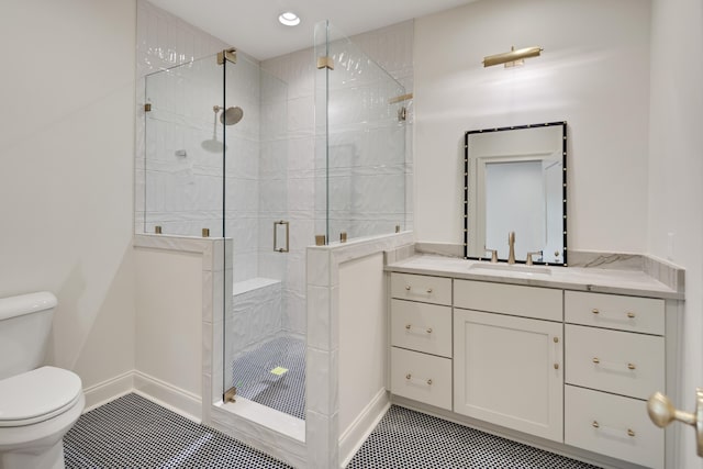 bathroom featuring tile patterned flooring, vanity, toilet, recessed lighting, and a stall shower