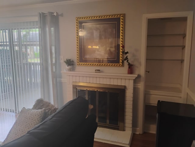 855 Creekside St Unit 303, Memphis, TN 38117 - room details featuring crown molding, wood finished floors, and a fireplace