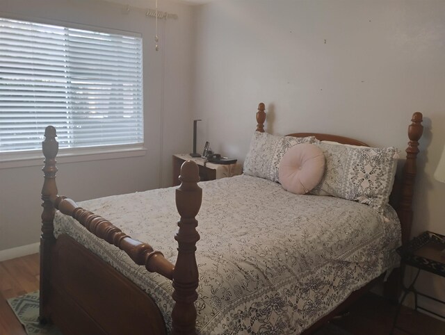 855 Creekside St Unit 303, Memphis, TN 38117 - bedroom with baseboards and wood finished floors