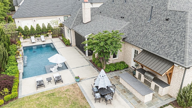 view from above of property with a pool area