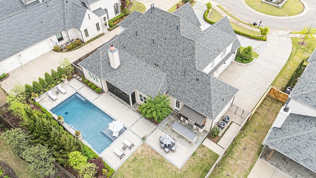 view of subject property with a pool area