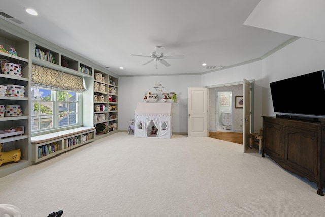 rec room with light carpet, a ceiling fan, recessed lighting, and crown molding