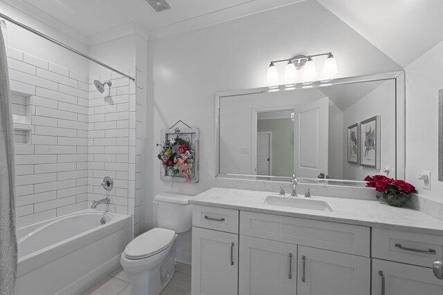 bathroom featuring toilet, vanity, shower / bath combo with shower curtain, and tile patterned floors