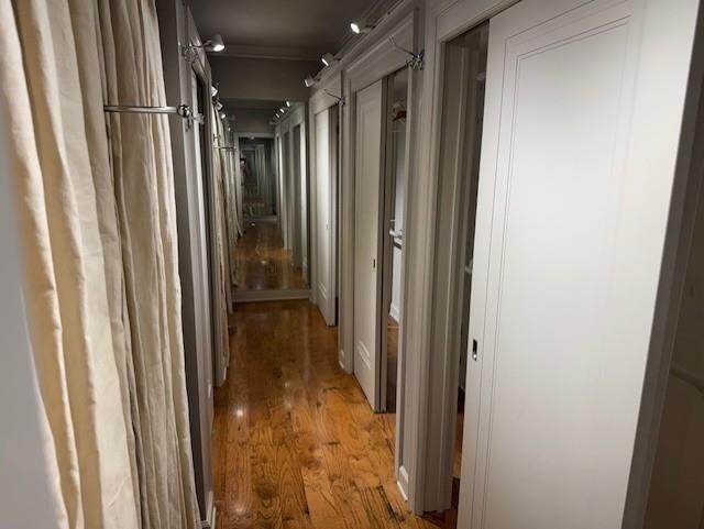 hallway with light wood-type flooring