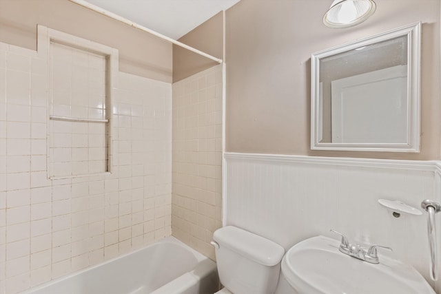 3684 Marion Ave, Memphis, TN 38111 - bathroom featuring a sink, shower / bathing tub combination, wainscoting, and toilet