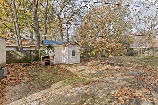 3684 Marion Ave, Memphis, TN 38111 - view of yard with an outbuilding, a fenced backyard, and a shed