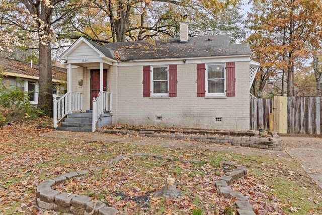 3684 Marion Ave, Memphis, TN 38111 - view of front of home with brick siding, crawl space, fence, and a chimney