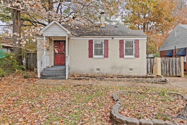 3684 Marion Ave, Memphis, TN 38111 - view of front of home featuring a chimney, brick siding, fence, and crawl space