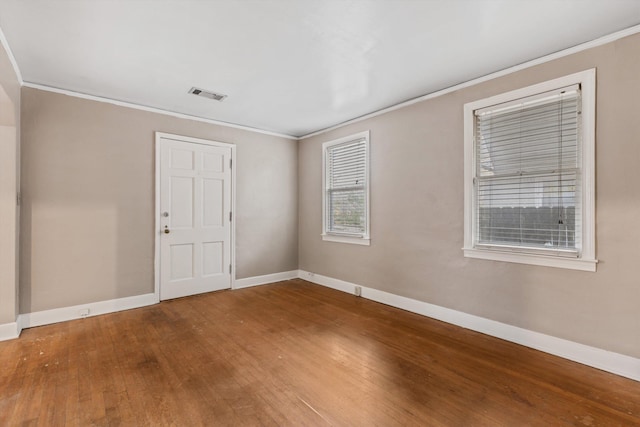3684 Marion Ave, Memphis, TN 38111 - empty room featuring visible vents, ornamental molding, baseboards, and wood finished floors