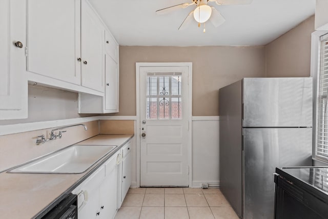 3684 Marion Ave, Memphis, TN 38111 - kitchen with freestanding refrigerator, a ceiling fan, white cabinetry, a sink, and light tile patterned floors