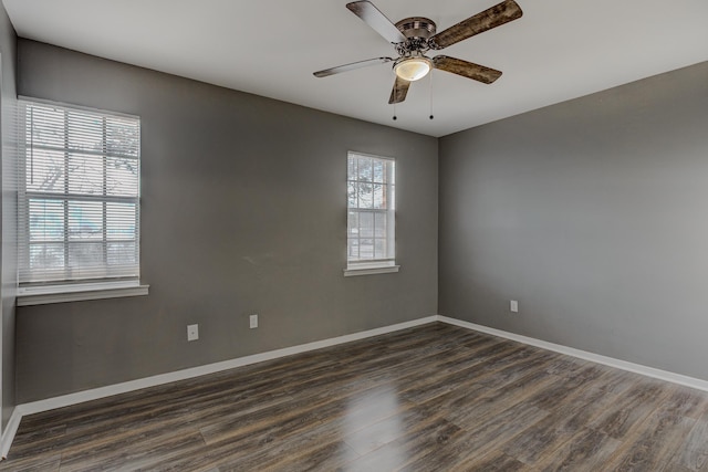 unfurnished room featuring a ceiling fan, baseboards, and wood finished floors