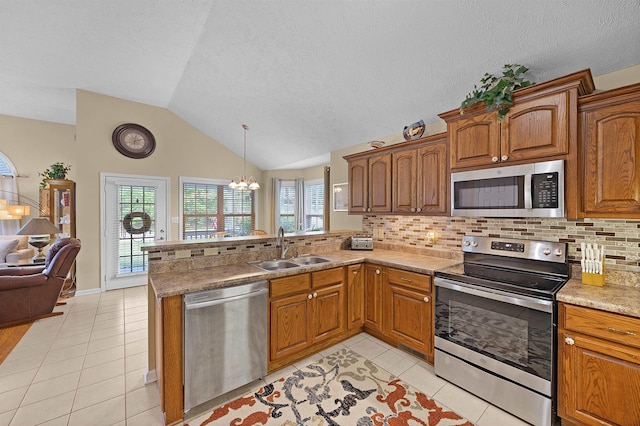 165 Ping Hill Dr, Counce, TN 38326 - kitchen featuring appliances with stainless steel finishes, a notable chandelier, a sink, a peninsula, and open floor plan