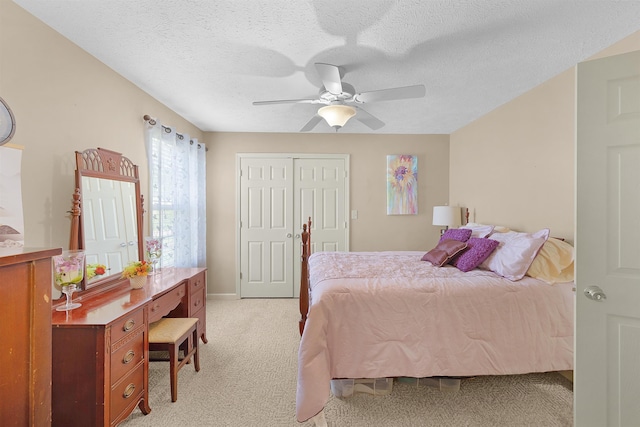 165 Ping Hill Dr, Counce, TN 38326 - bedroom featuring baseboards, ceiling fan, light carpet, and a textured ceiling