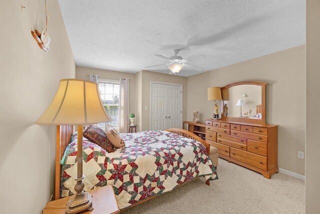 165 Ping Hill Dr, Counce, TN 38326 - carpeted bedroom featuring a closet, a textured ceiling, and ceiling fan