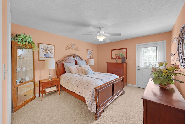 165 Ping Hill Dr, Counce, TN 38326 - bedroom with baseboards, ceiling fan, a textured ceiling, and light colored carpet