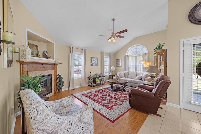 165 Ping Hill Dr, Counce, TN 38326 - living room featuring plenty of natural light, a tiled fireplace, ceiling fan, and vaulted ceiling
