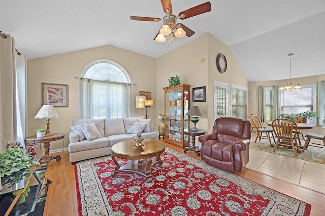 165 Ping Hill Dr, Counce, TN 38326 - living area with a healthy amount of sunlight, ceiling fan with notable chandelier, and wood finished floors