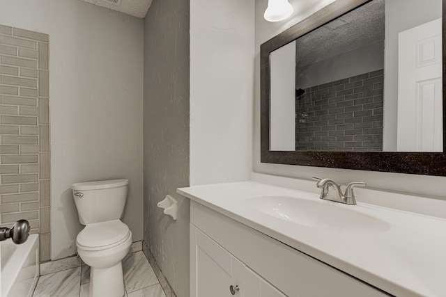 full bath with vanity, marble finish floor, and toilet