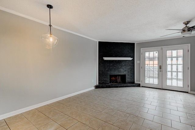 unfurnished living room featuring ceiling fan, a textured ceiling, light tile patterned floors, baseboards, and ornamental molding
