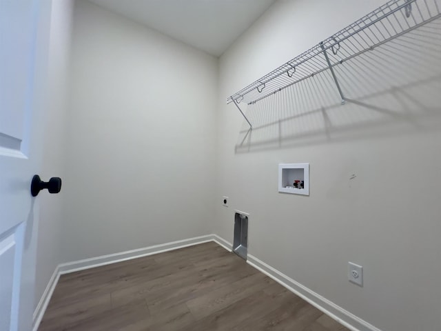 laundry room with laundry area, baseboards, dark wood-style floors, washer hookup, and hookup for an electric dryer
