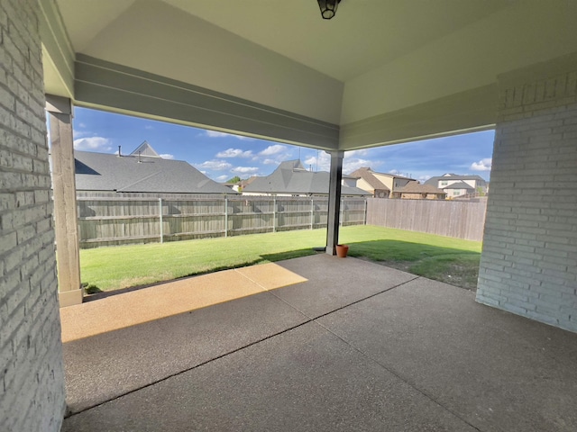 view of patio with a fenced backyard and a residential view