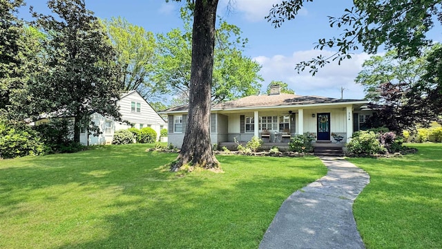 254 S White Station Rd, Memphis, TN 38117 - view of front facade featuring covered porch, a chimney, and a front yard