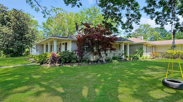 254 S White Station Rd, Memphis, TN 38117 - view of front of home featuring a front lawn and a chimney