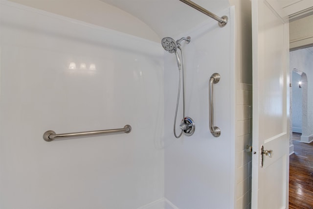 full bath with walk in shower and wood finished floors