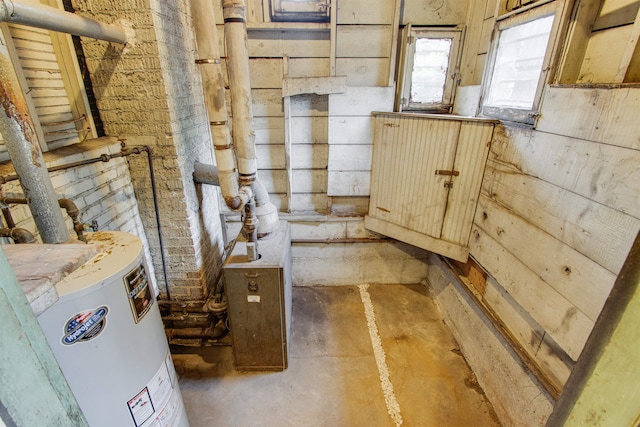 utility room with gas water heater