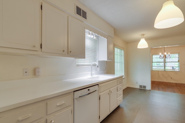 kitchen featuring white dishwasher, a notable chandelier, a sink, and visible vents