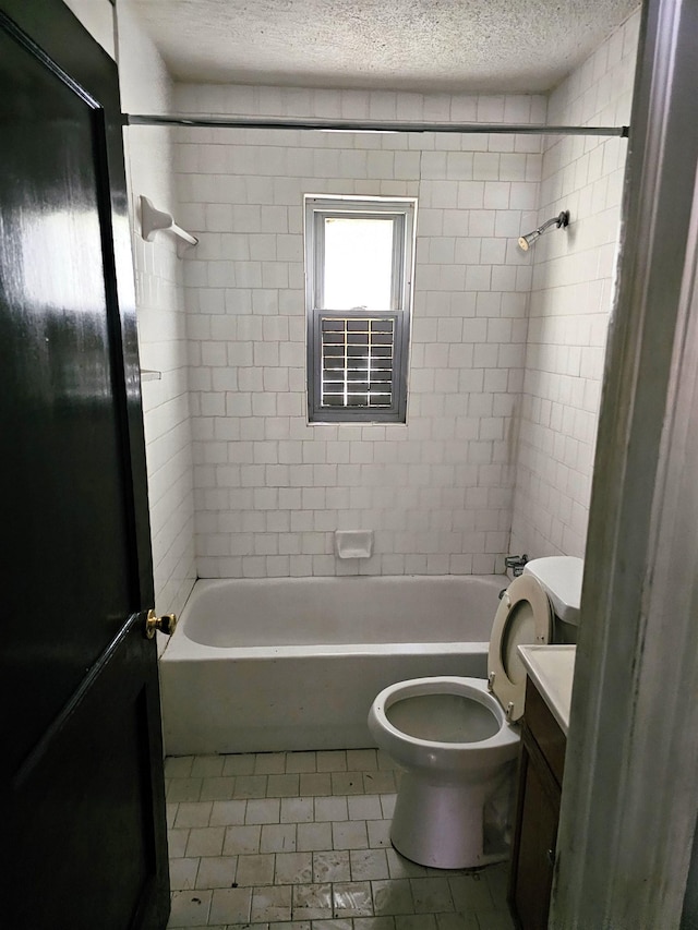 full bathroom featuring tile patterned flooring, vanity, toilet, shower / tub combination, and a textured ceiling