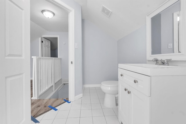 half bath with visible vents, tile patterned flooring, vanity, toilet, and lofted ceiling