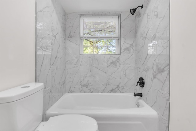 bathroom with toilet and  shower combination