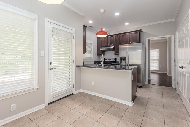 kitchen with crown molding, light tile patterned flooring, dark brown cabinetry, appliances with stainless steel finishes, and under cabinet range hood