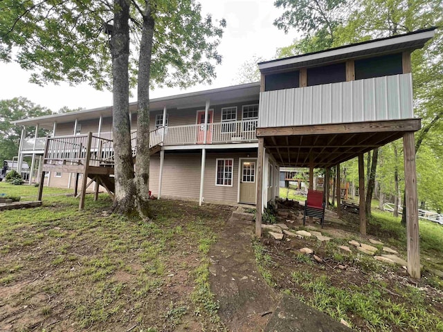 rear view of house with a wooden deck